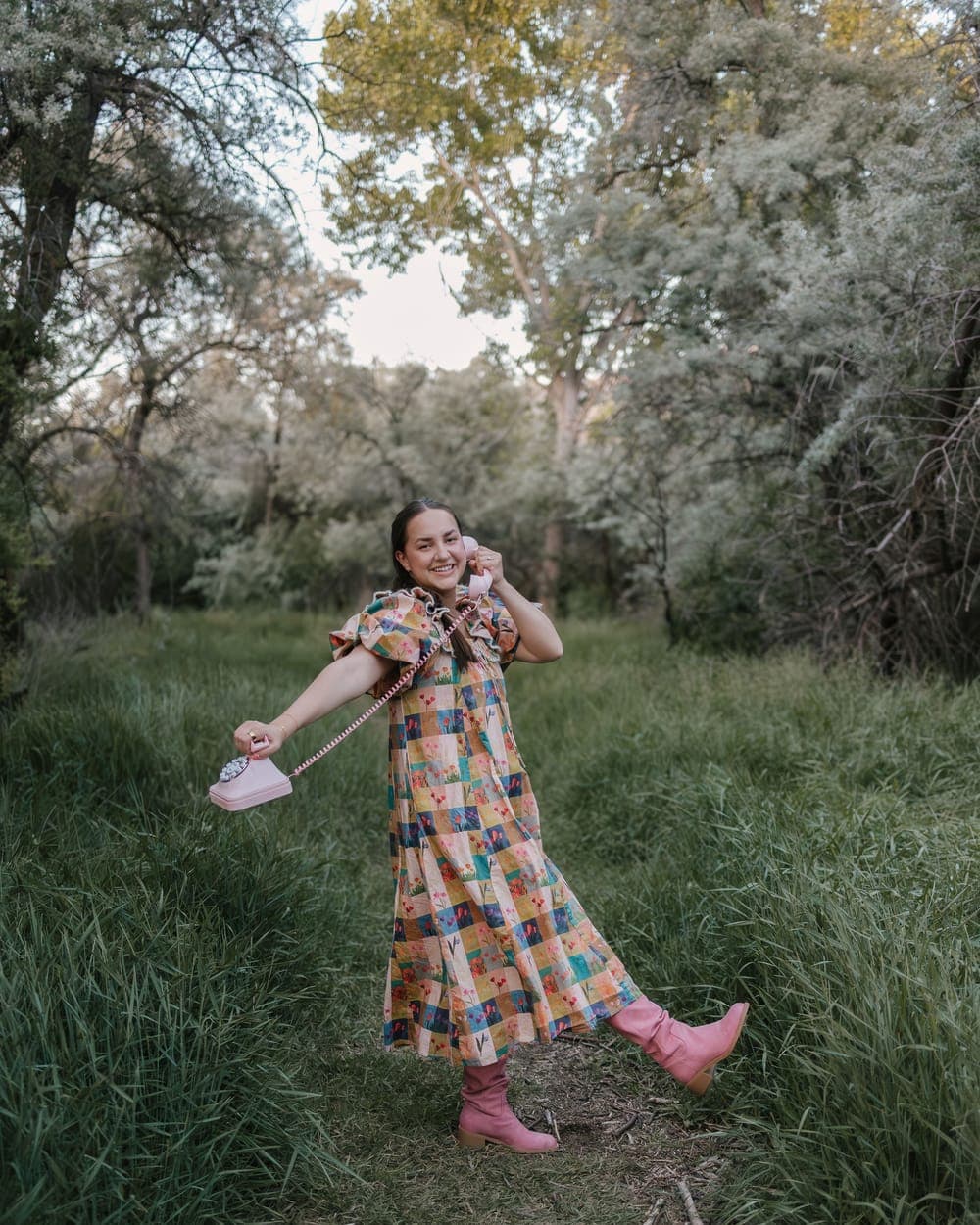 Sydney mid-twirl with a pink phone